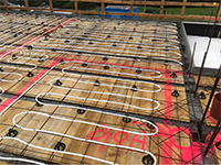John Guest Underfloor Heating installation completed at the Sarten Residence new zealand maintained by John Guest Aura thermostat connected by a probe in the floor a comfortable and warm environment